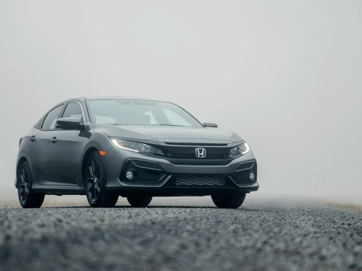 Gray Honda Civic on a foggy road